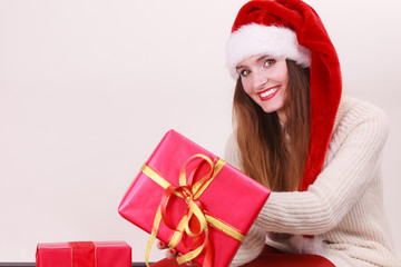 Woman holding gift box. Christmas time