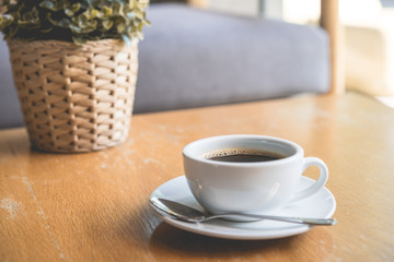 Coffee white cup , Black coffee on wood table ,warm and good smell