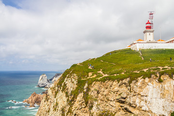 Fototapeta na wymiar Lighthouse, cliffs and trails in Cabo da Roca