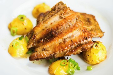Roasted fish with potato.
