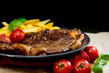 juicy steak beef meat with tomato and french fries