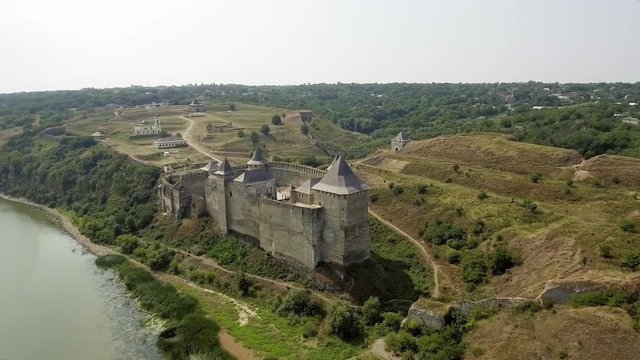 Aerial view of Khotyn medieval castle on the green hill above the river.