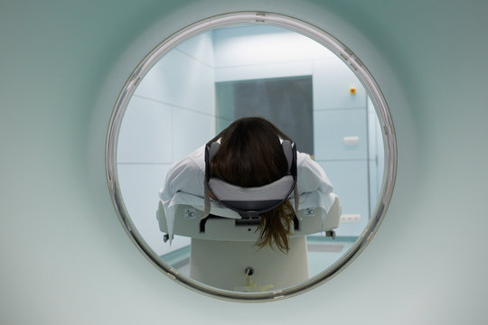 Back view of a CT scan with a patient lying in