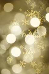 Golden blurred bokeh lights for Christmas and New Year celebration. Magical abstract glittery backgroun with falling snowflakes. - 176868506
