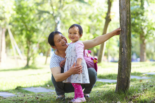 senior asian woman with her granddaughter outdoor