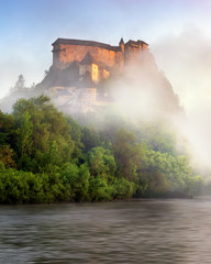 Fototapeta na wymiar Oravsky Hrad and Orava River in the Morning Mist, Slovakia