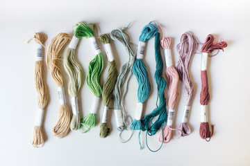Colourful Embroidery Threads on a White Background