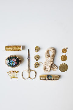 Golden Items Arranged on a White Background