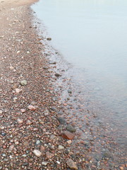Calm sea, on the sandy beach near the water
