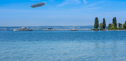 A passenger ship at the pier of the village Immenstaad at Lake Constance with zeppelin - Immenstaad, Lake Constance, Baden-Wuerttemberg, Germany, Europe © karlo54