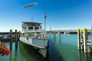 Excursion boat in the port of Meersburg with zeppelin - Meersburg, Lake Constance, Baden-Wuerttemberg, Germany, Europe © karlo54
