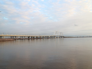 Obraz premium Cable-stayed bridge over the big river in the evening