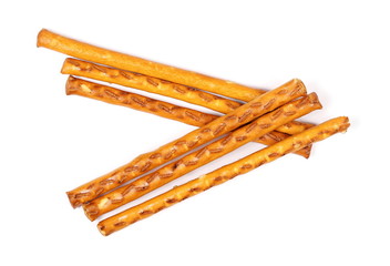 Salty cracker pretzel sticks isolated on white background, top view