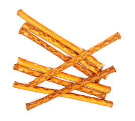 Salty cracker pretzel sticks isolated on white background, top view