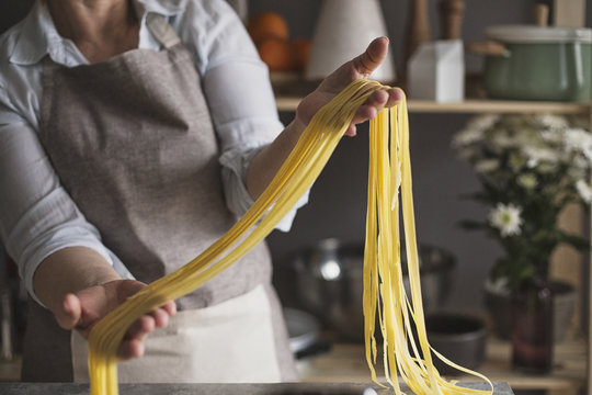 Woman Holding Homemade Pasta