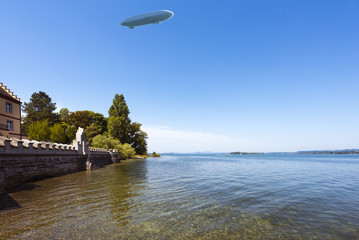 The waterside near Niederzell on the island Reichenau with zeppelin - Island of Reichenau, Lake Constance, Baden-Wuerttemberg, Germany, Europe © karlo54