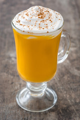 Pumpkin spiced latte on wooden table