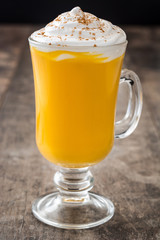 Pumpkin spiced latte on wooden table