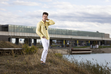 Handsome young man wearing jeans and sunglasses