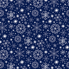 Seamless pattern with snowflakes on the blue background.