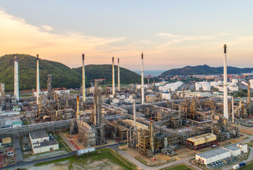 Aerial view Oil refinery.Industrial view at oil refinery plant form industry zone with sunrise and cloudy sky.Oil refinery and Petrochemical plant at dusk,Thailand. Oil refinery background sunset.
