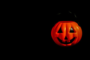 Hanging many horror or scary pumpkin for Halloween Day concept, space for your content and isolated on black background.