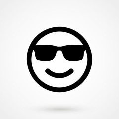 Smiley face with sun glasses vector icon.