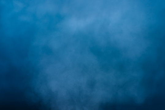 Abstract white water vapor on a blue background. Texture. Design elements.