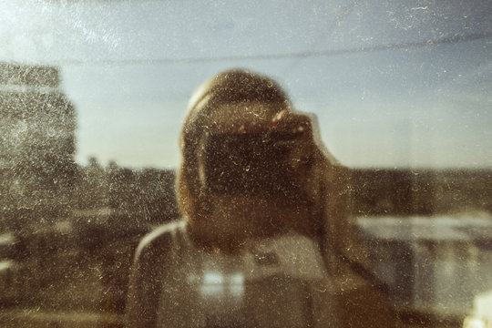 selfie in a dirty window