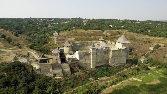 Aerial view of Khotyn medieval castle on the green hill above the river.