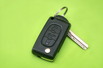 car key isolated on green. close up