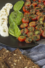 Cherry tomatoes with mozzarella and basil
