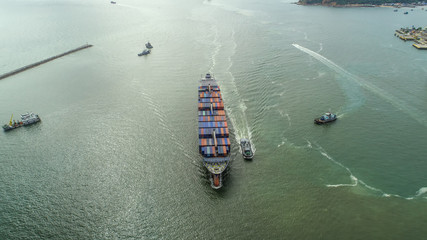 Obraz premium container,container ship in import export and business logistic,By crane,Trade Port , Shipping,cargo to harbor.Aerial view,Water transport,International,Shell Marine,transportation,logistic,trade,port