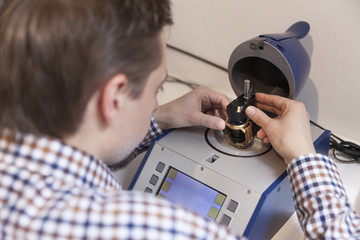 Clockmaker working in workshop