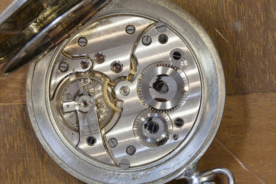 Deconstructed watch lying on table