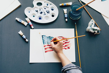 Woman painting an american flag