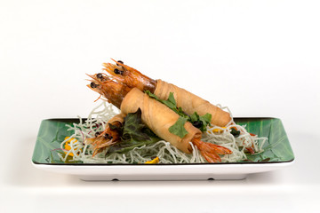 Fried Shrimps wrapped and crispy fried noodles on white background