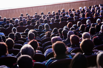 People in the auditorium during the performance. A theatrical production.