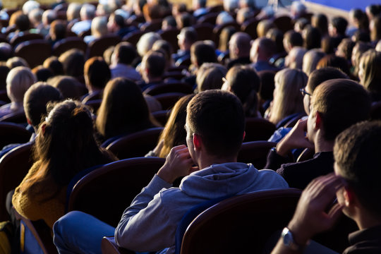 People in the auditorium during the performance. A theatrical production.