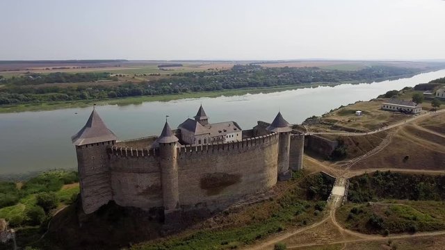 Aerial view of Khotyn medieval castle on the green hill above the river.