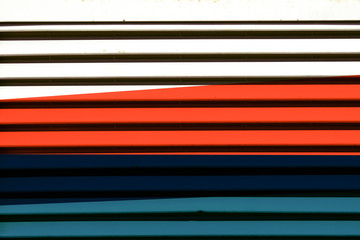 Colored roller shutter with light blue, black, orange and white mood