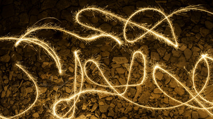 Overhead Aerial View of Sparkler Trails of Kids Playing with Sparklers