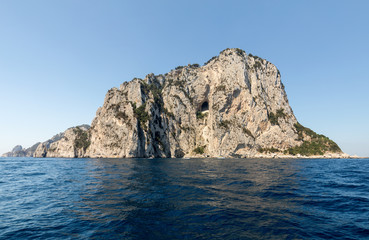 Fototapeta na wymiar The Island of Capri is a very picturesque, luxuriant and extraordinary location in Italy famous for its high rocks.