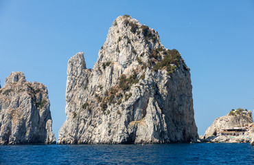 Fototapeta na wymiar View from the boat on the Faraglioni Rocks on Capri Island, Italy.