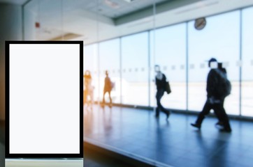 blank advertising billboard or showcase light box with copy space for your text message or media and content with people in terminal at airport, people, commercial, marketing and advertising concept