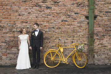 Bride and groom on a bicycle
