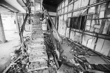 The ruined stairs of an old hotel.