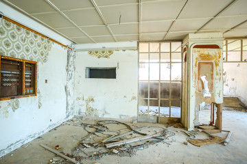 The interior of an old ruined hotel.