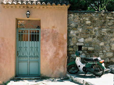 Door front and motorbike in Plaka, Athens