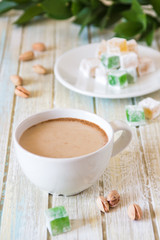 Coffee with milk, pistachios and Turkish Delight